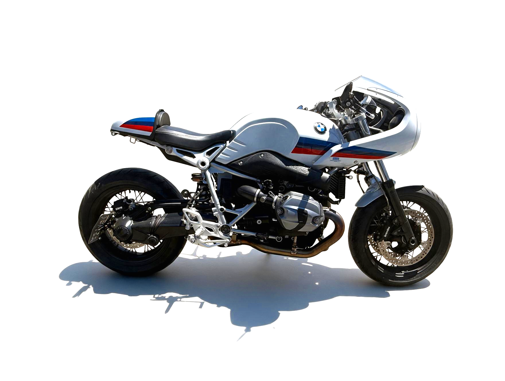 2017 BMW R nineT Racer shown in a right-facing full side profile with Light White bodywork, BMW Motorsport-inspired graphics, boxer engine, fairing, wire-spoke wheels, and café-racer seating.