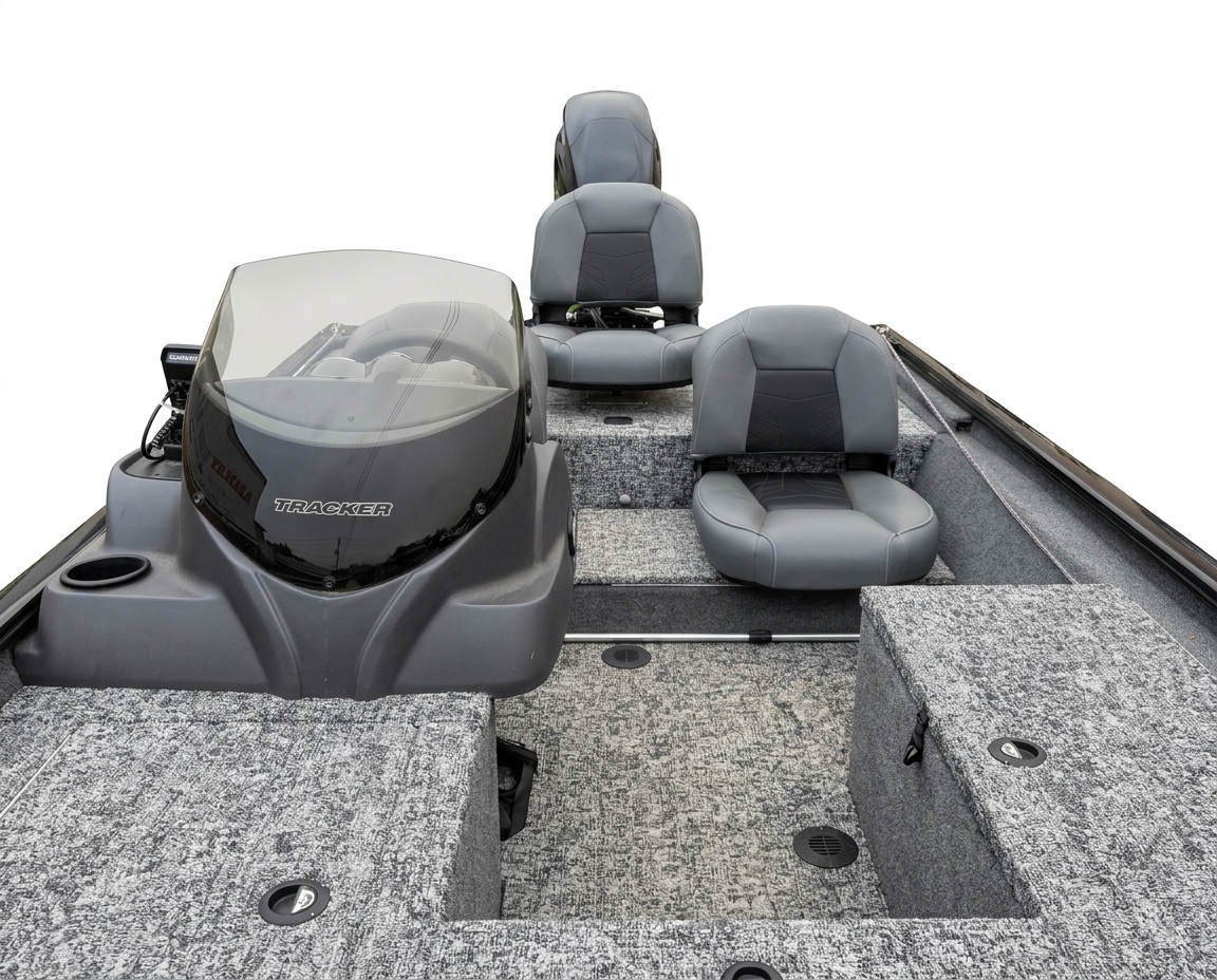 Interior cockpit view showing the Tracker helm console, windshield, seating, carpeted deck, and storage compartments.